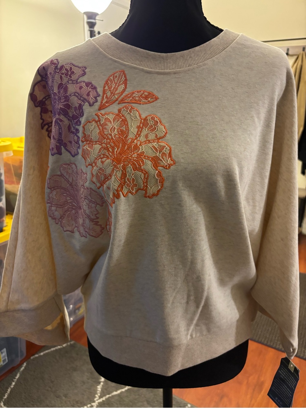 Democracy Cream Crewneck Sweater with Purple & Orange Floral Appliqué